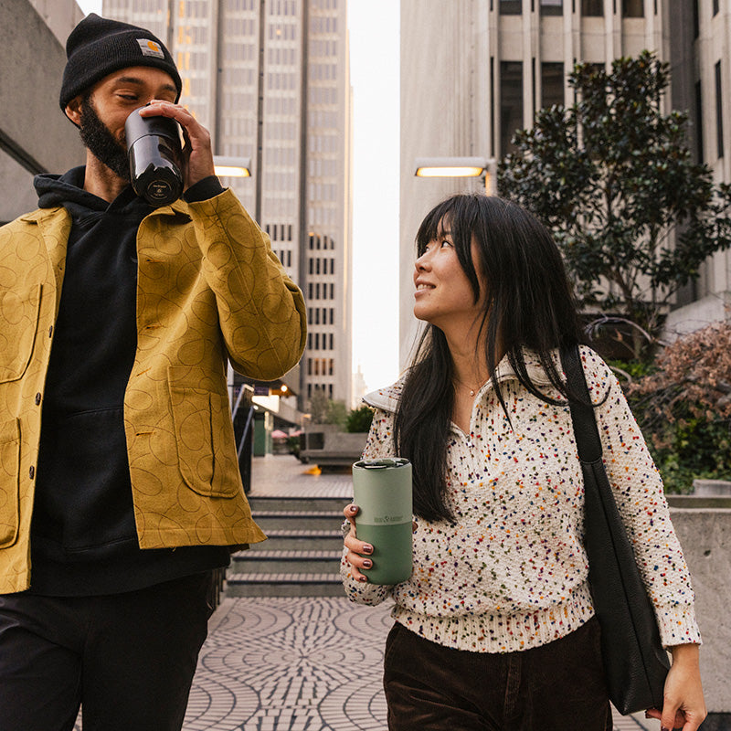 16oz-rise-tumbler-n5 16oz_rise_tumbler_black_iceberg_couple_drink_city_street_square.jpg