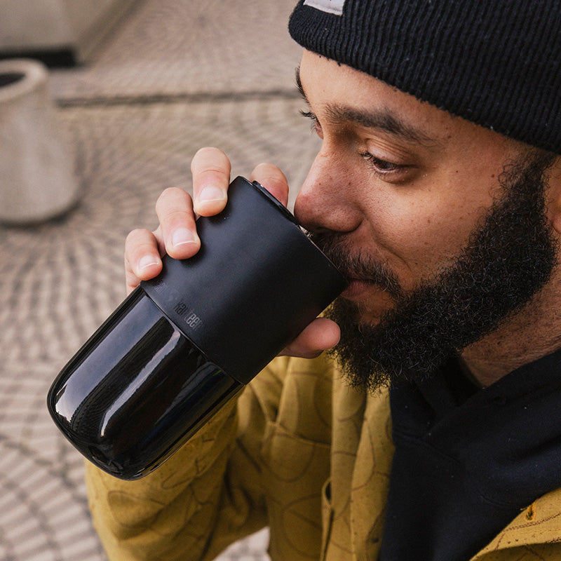 daily-on-the-go-set-j1 16oz_rise_tumbler_black_man_drink_square.jpg