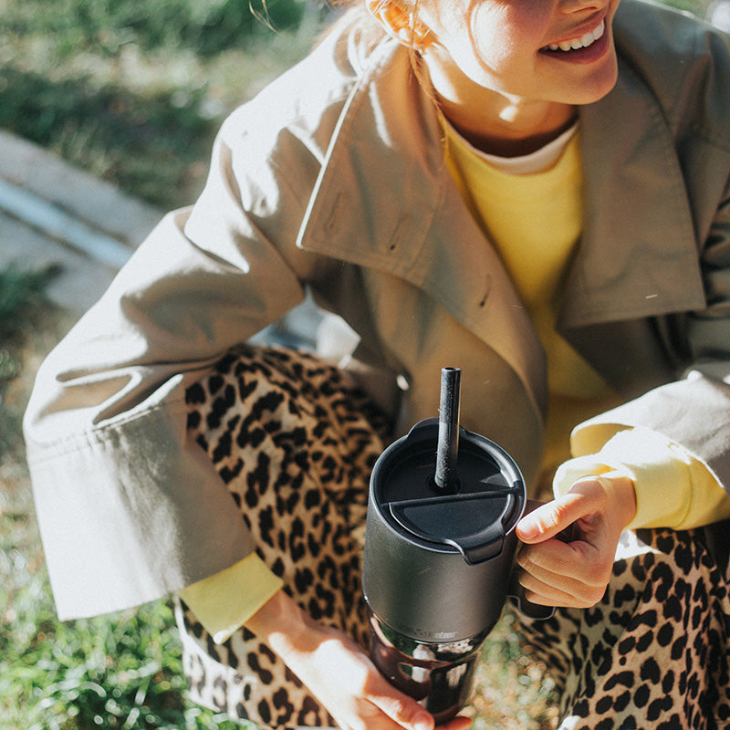 26oz-rise-tumbler-with-straw-lid-b8 26oz_rise_tumbler_black_woman_topview_square.jpg