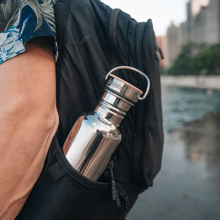 27oz-reflect-with-bamboo-cap-g4 K27SSLRF-MS-BAMBOO_reflect-bottle_backpack_lifestyle.jpg